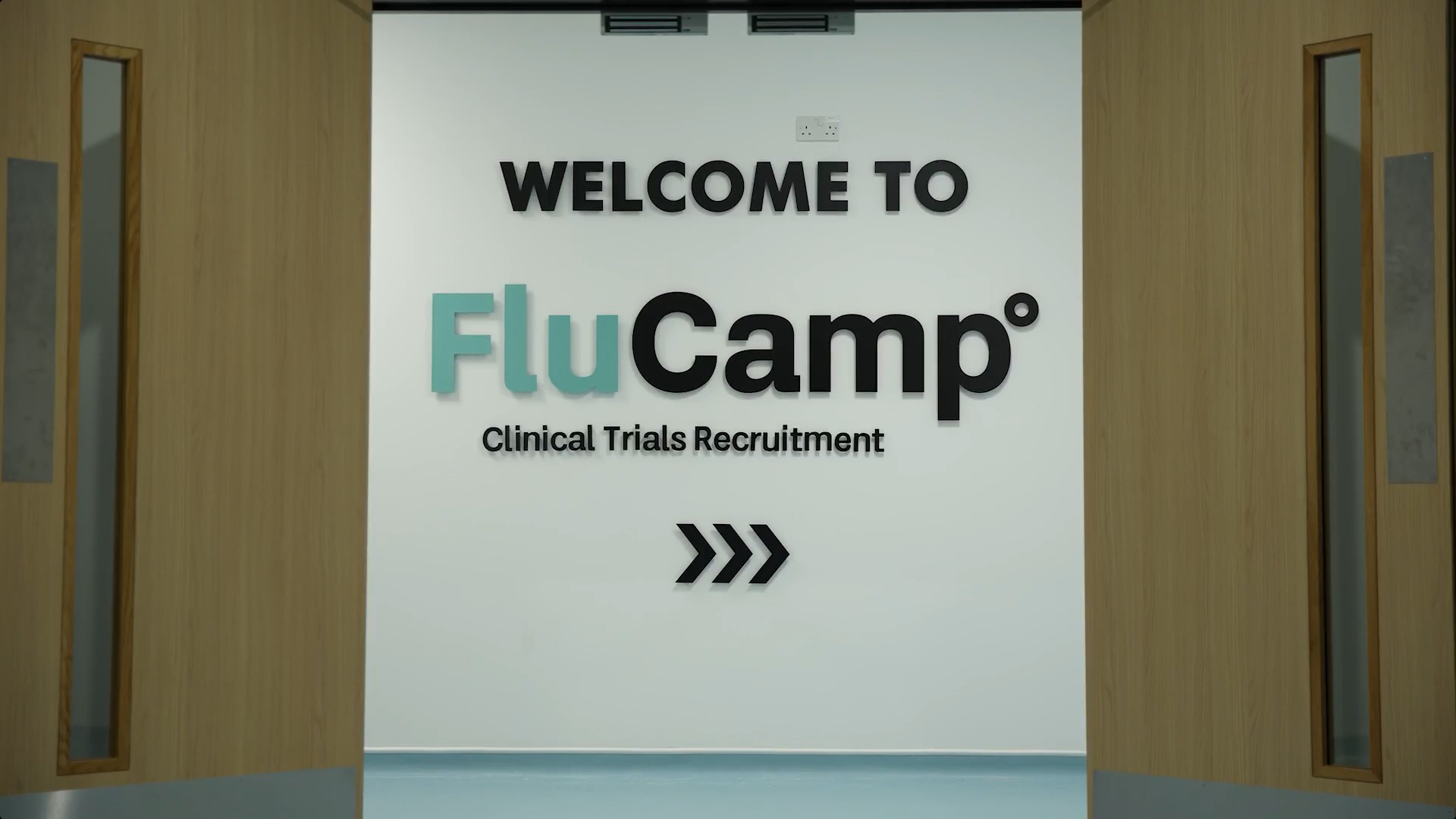 Welcome to FluCamp logo on a wall